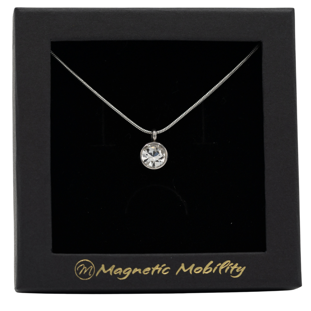 
                  
                    Load image into Gallery viewer, April Magnetic Mobility Birthstone Necklace showcasing a clear Swarovski crystal pendant with a magnetic back. Provides neck pain relief, elegantly boxed with Magnetic Mobility branding.
                  
                