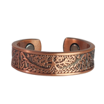 Buckthorn copper ring by Magnetic Mobility featuring an intricate Tree of Life design. This adjustable ring is designed to be easily worn on arthritic fingers, providing both style and functionality.