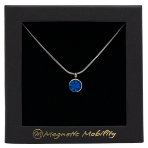 
                  
                    Load image into Gallery viewer, December Magnetic Mobility Birthstone Necklace featuring a Blue Swarovski crystal pendant with a magnetic back. Ideal for relieving neck pain, displayed in a black box with Magnetic Mobility logo
                  
                