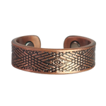 Hawthorn copper ring by Magnetic Mobility featuring an intricate geometirc design. This adjustable ring is designed to be easily worn on arthritic fingers, providing both style and functionality.