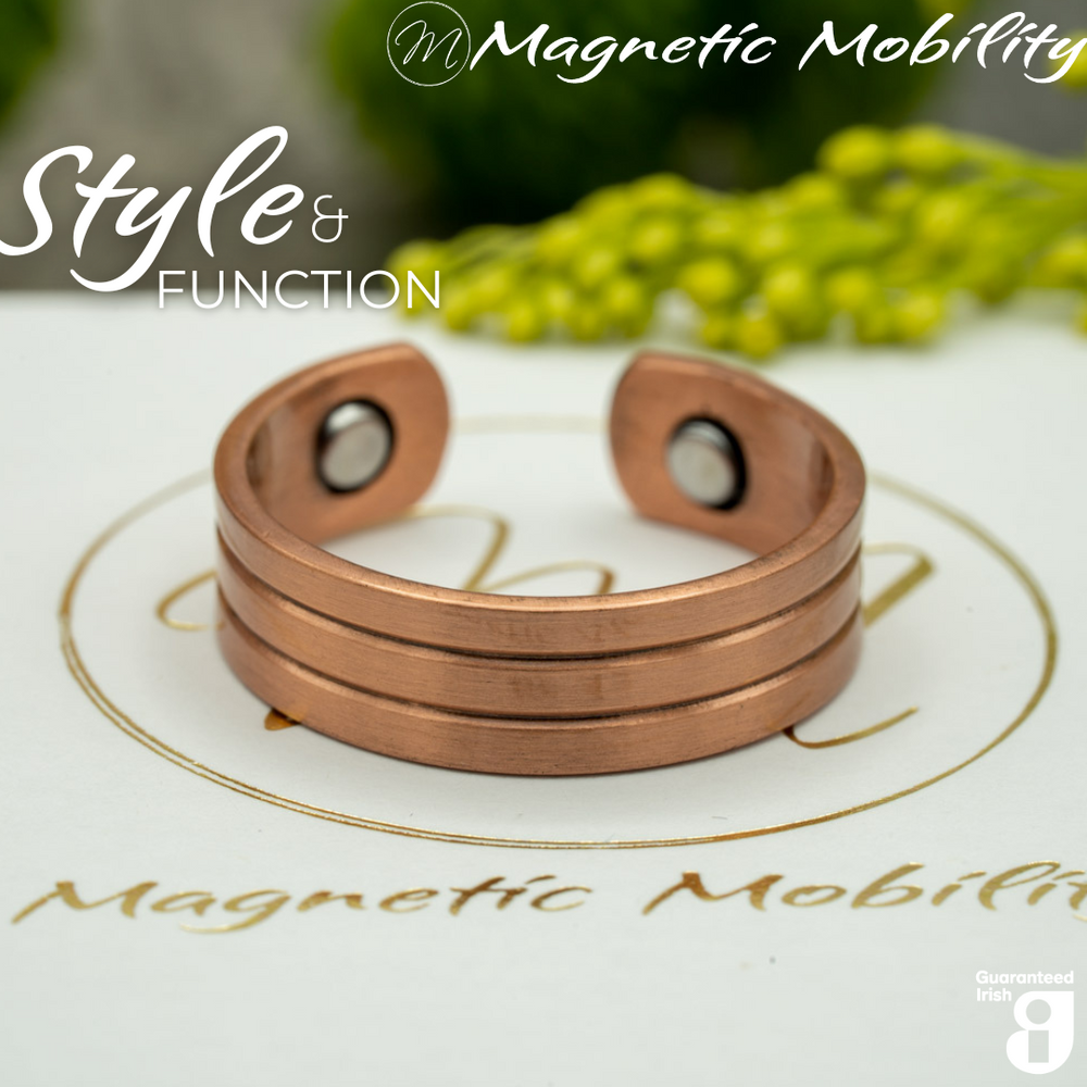 
                  
                    Load image into Gallery viewer, Heath copper ring by Magnetic Mobility featuring a simple design. Ring is shown on top of a white branded gift box. This adjustable ring is designed to be easily worn on arthritic fingers, providing both style and functionality.
                  
                