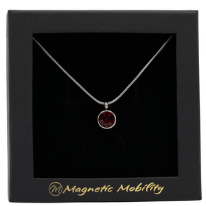 
                  
                    Load image into Gallery viewer, July Birthstone Necklace by Magnetic Mobility featuring a dark red Swarovski crystal pendant with a magnetic back. Perfect for alleviating neck pain, showcased in black packaging.
                  
                