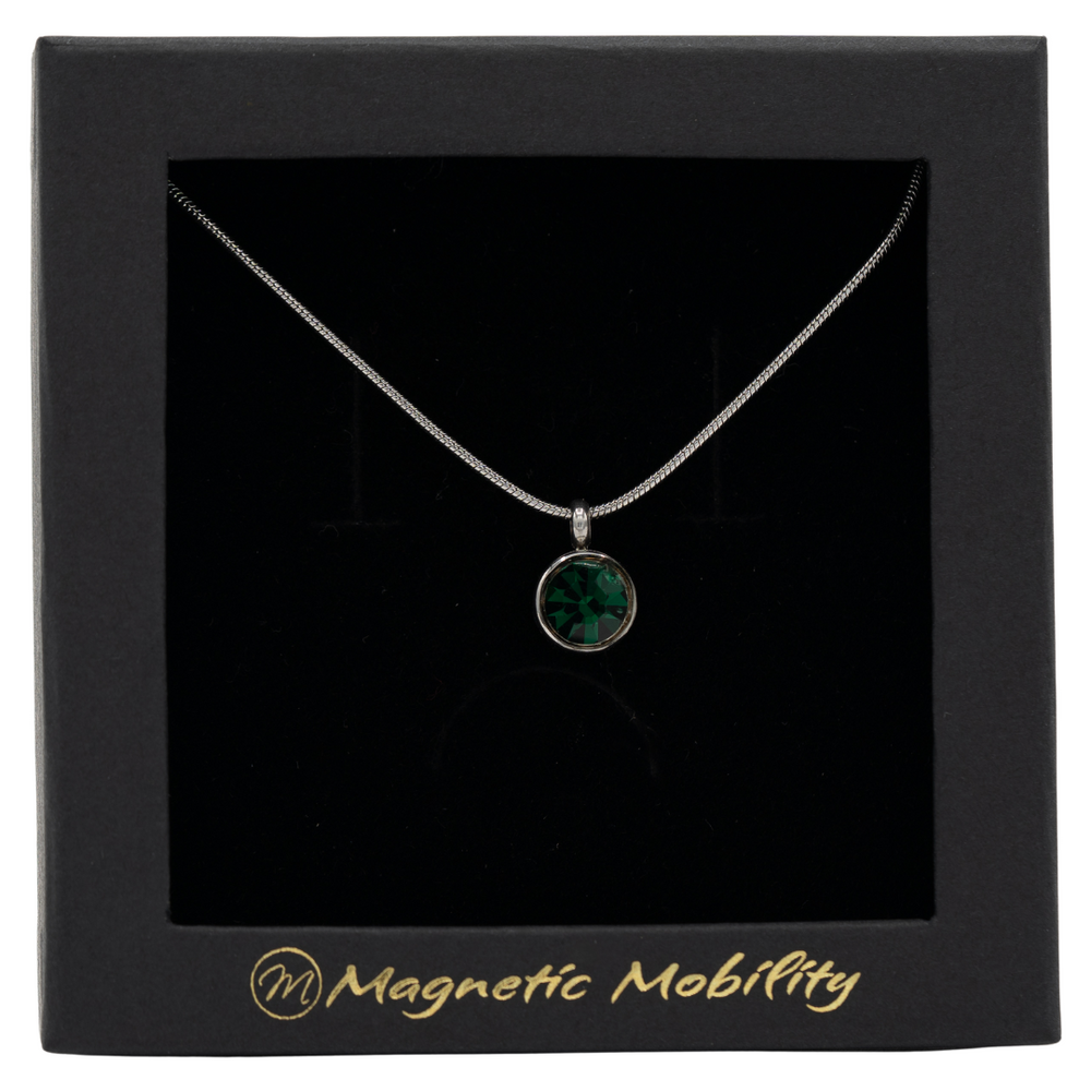 
                  
                    Load image into Gallery viewer, May Magnetic Mobility Birthstone Necklace with a green Swarovski crystal pendant. Designed to help with neck pain, beautifully presented in black packaging with Magnetic Mobility logo
                  
                