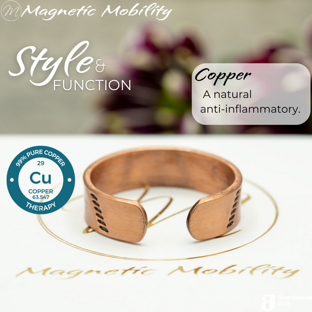 
                  
                    Load image into Gallery viewer, Back view of the Soloman copper ring from Magnetic Mobility. Shown on a white gift box with purple plants in the background. The writing says &amp;quot;Style and Function&amp;quot;. The back is open to allow for swelling of arthritic fingers. 
                  
                