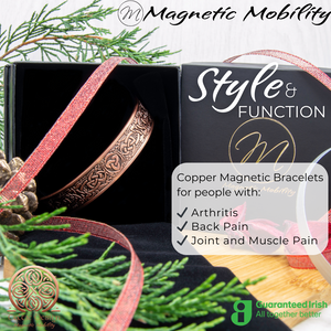 
                  
                    Load image into Gallery viewer, Front view of the Trinity copper bracelet by Magnetic Mobility. Shown inside a black gift box and Christmas decorations. The words &amp;quot;Style and Function&amp;quot; are written on the image along with &amp;quot;Copper Magnetic Bracelets for people with arthritis, back pain and more&amp;quot;. Part of the Celtic Collection. Features a guaranteed Irish logo. 
                  
                